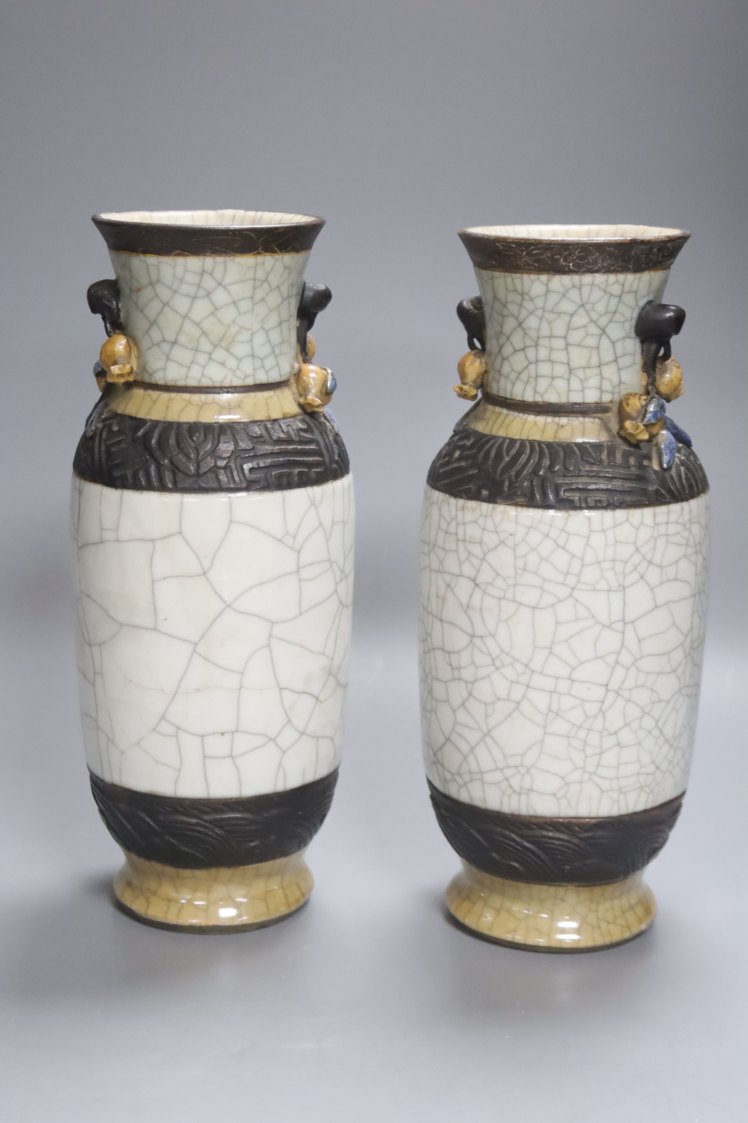 A late 19th century Chinese blue and white dish, together with a pair of crackle glaze vases and another, tallest 25cm